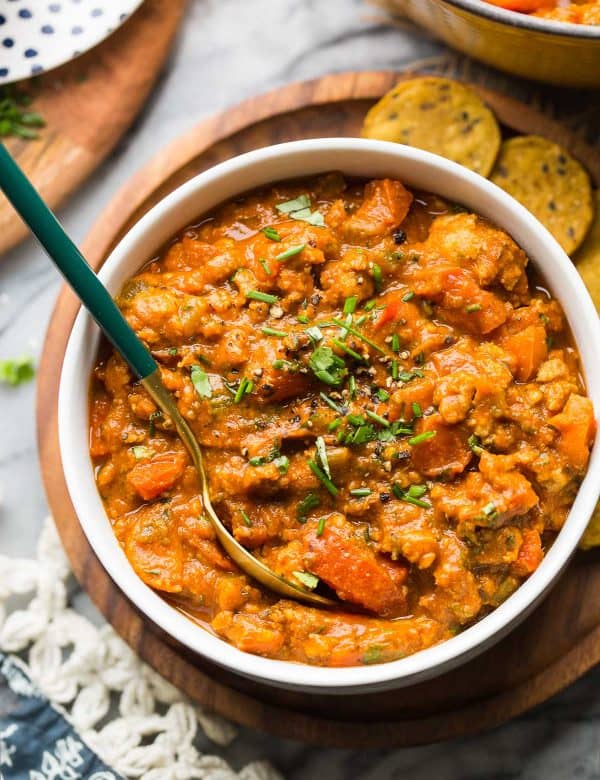 Low FODMAP Sausage Chili in a bowl topped with chives