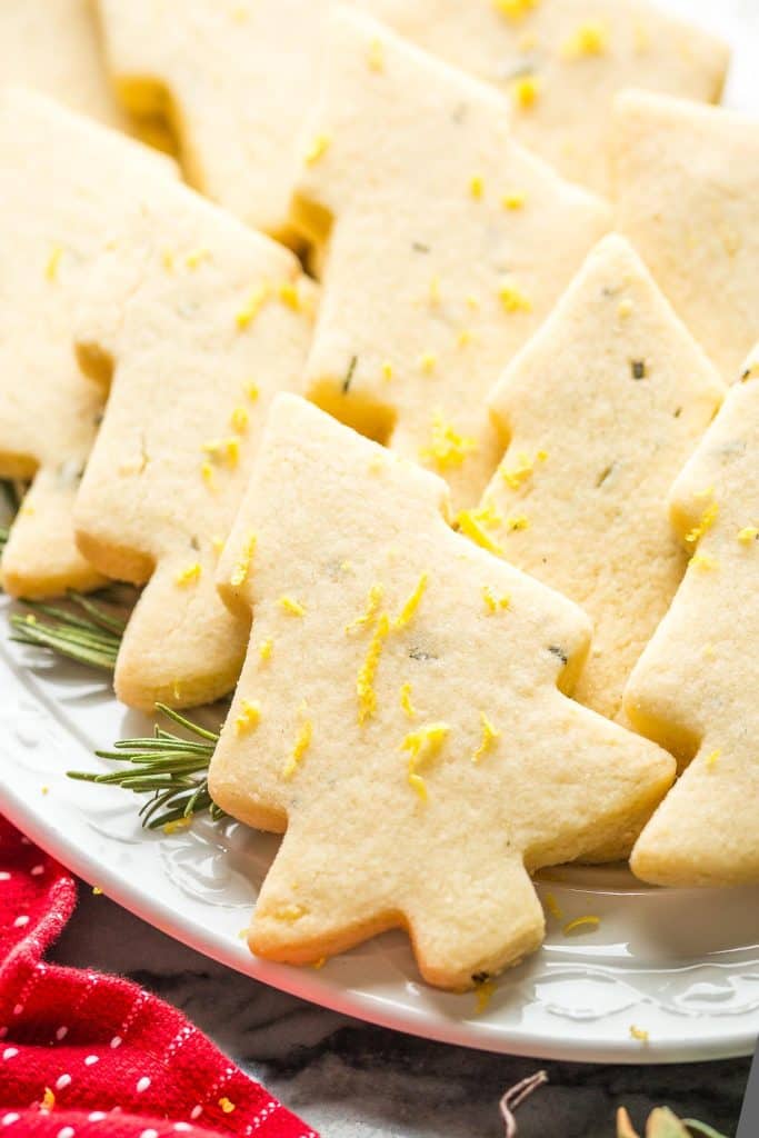 Rosemary Lemon Christmas Tree Cookies piled on a plate