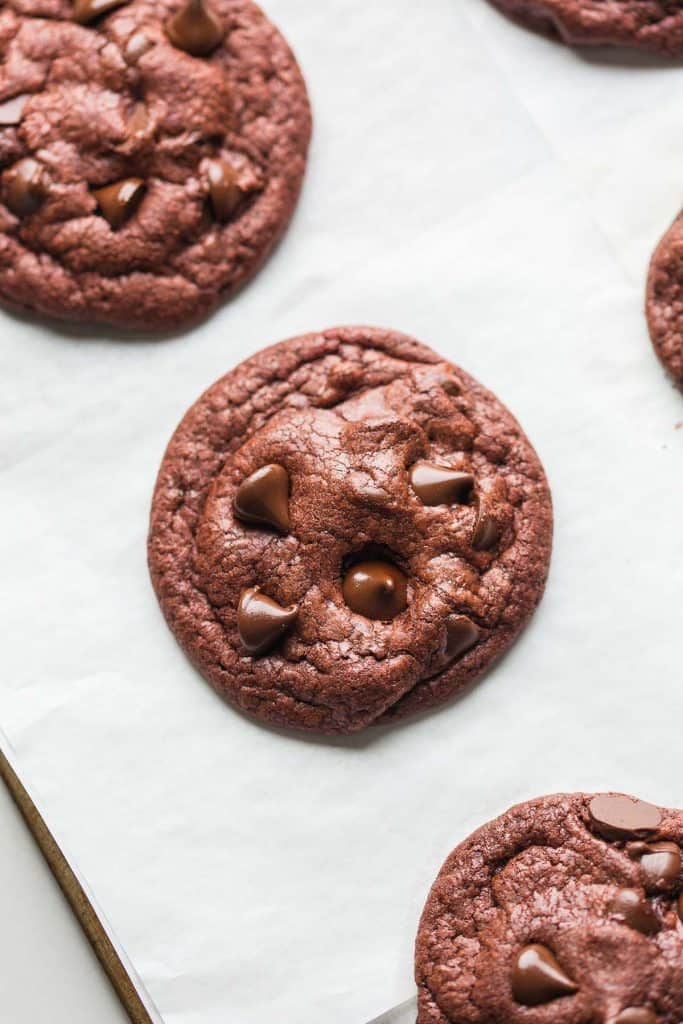 a Paleo Red Velvet Cookie on a baking sheet