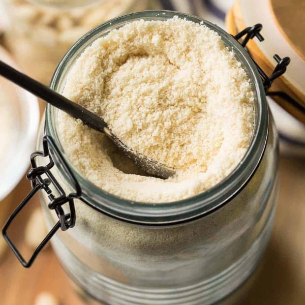 almond flour in a jar with a spoon