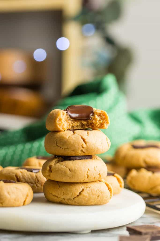 4 Gluten Free Peanut Butter Blossoms stacked on top of each other