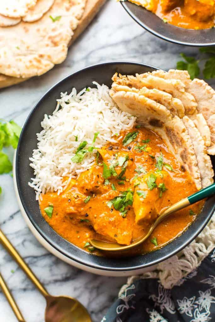 Dairy Free Butter Chicken in a bowl with rice and naan