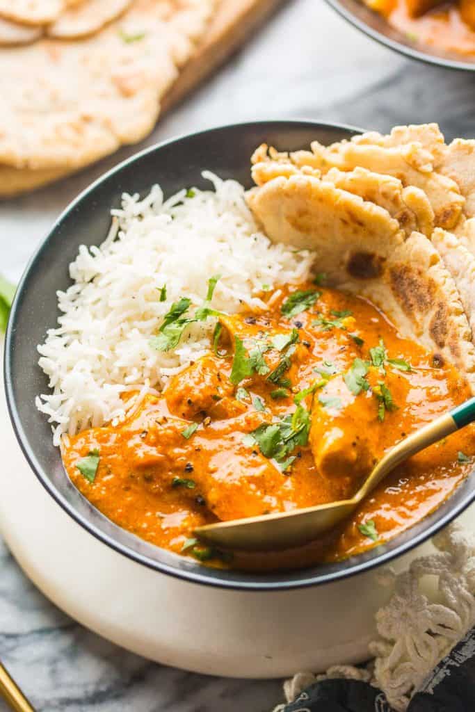 Dairy Free Butter Chicken topped with chopped cilantro in a bowl