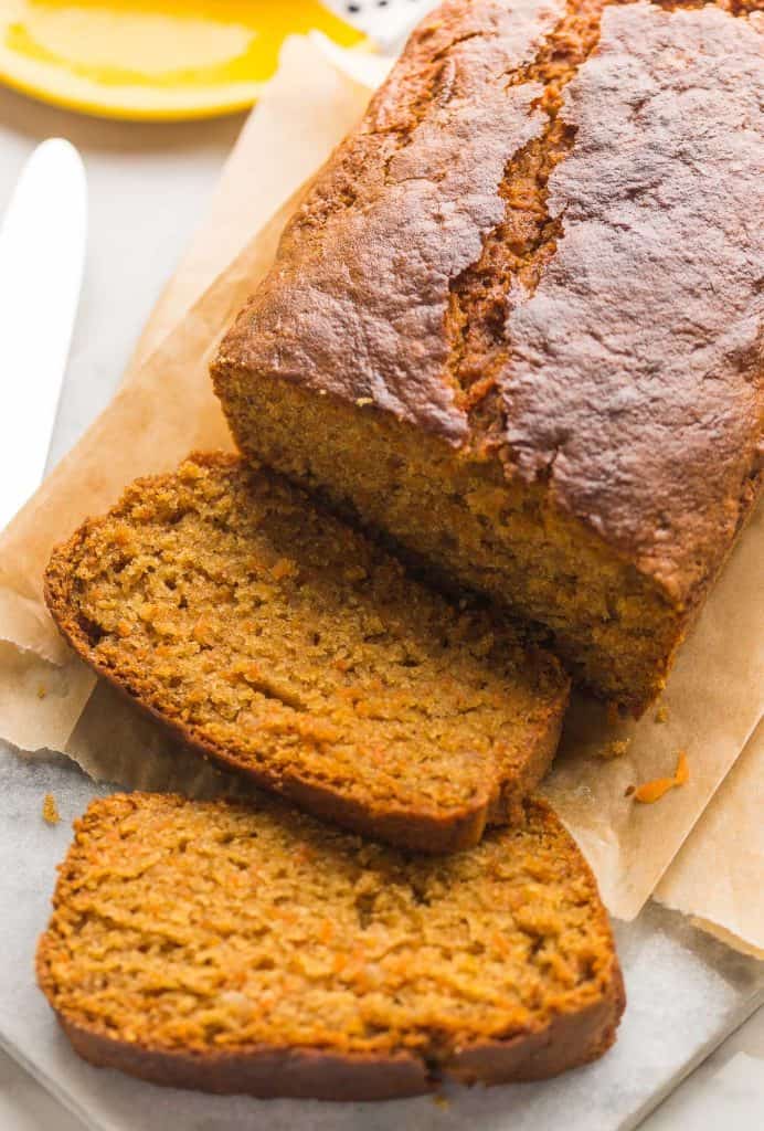 gluten free carrot cake loaf with a couple slices cut 