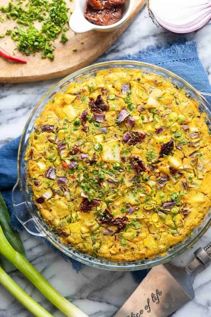 a freshly baked crustless vegan quiche in a baking dish