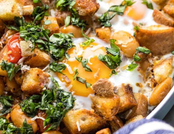 up close egg skillet topped with basil