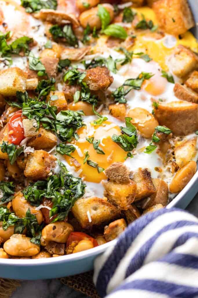 up close egg skillet topped with basil