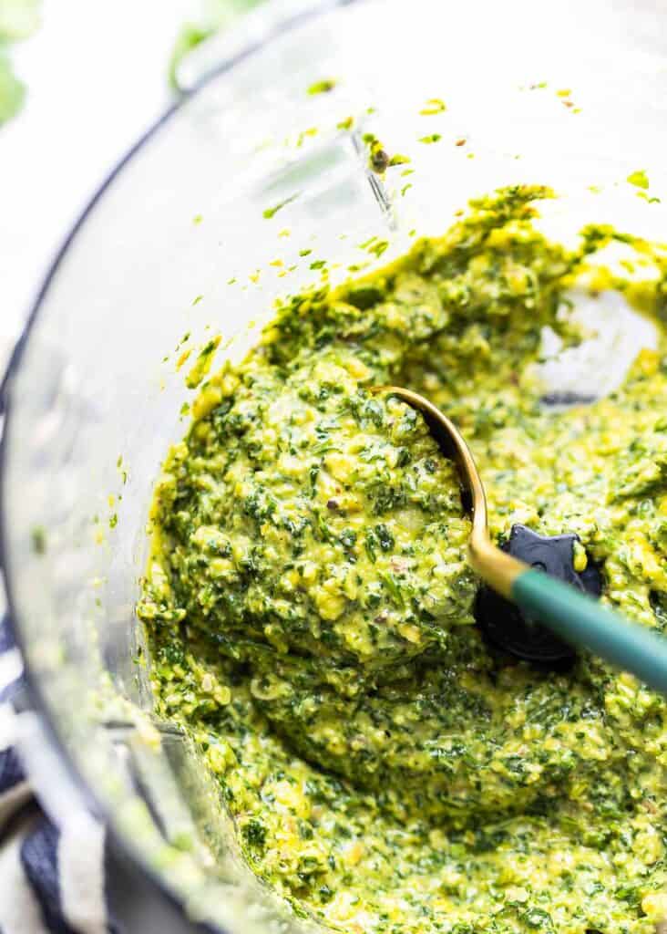 cilantro lime pesto in the bowl of a food processor