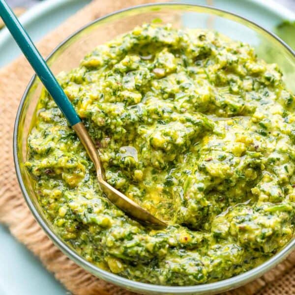 cilantro lime pesto in a small bowl with a spoon