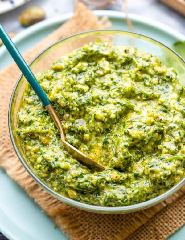 cilantro lime pesto in a small bowl with a spoon