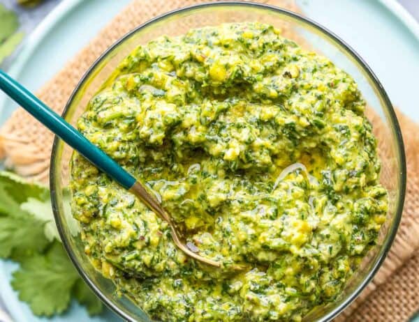 cilantro lime pesto in a bowl with a spoon