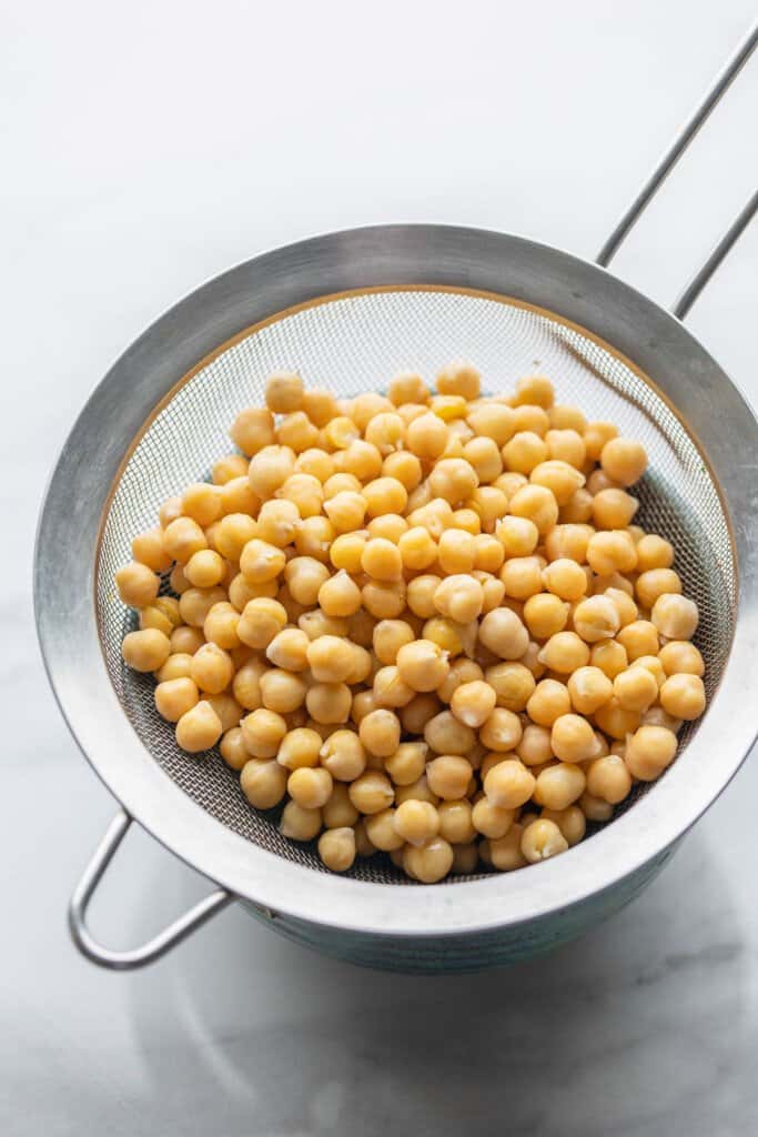 chickpeas in a fine mesh strainer