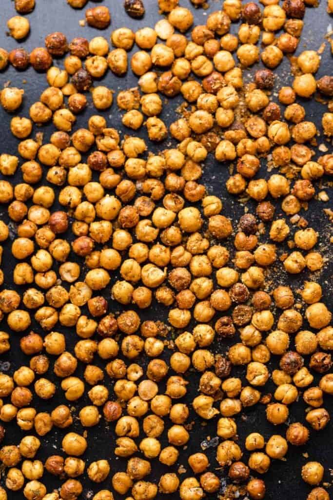 roasted chickpeas spread across a baking sheet