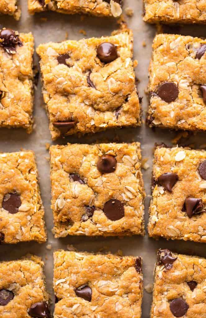 Peanut Butter Cookie Bars cut into little squares a piece of baking paper