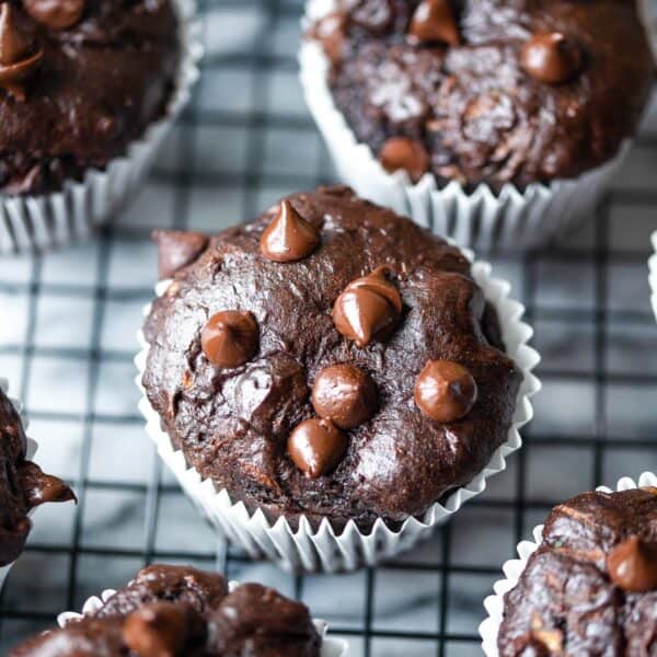 chocolate zucchini muffins cooling on a wire rack