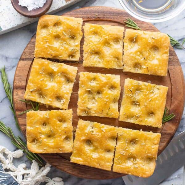 Gluten Free Focaccia topped with rosemary, cut into nine squares