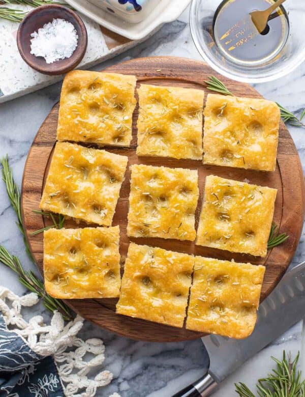 Gluten Free Focaccia topped with rosemary, cut into nine squares