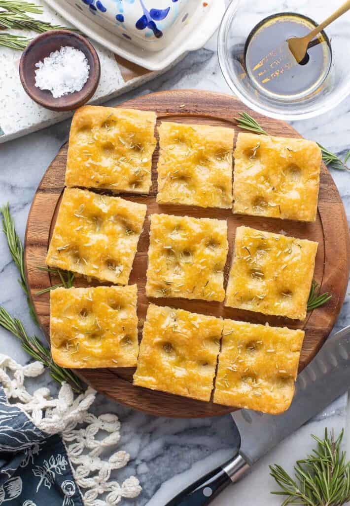 Gluten Free Focaccia topped with rosemary, cut into nine squares 