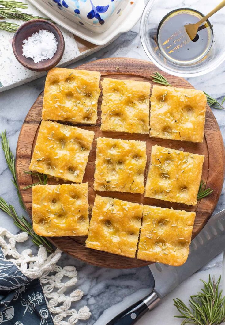 Gluten Free Focaccia topped with rosemary, cut into nine squares