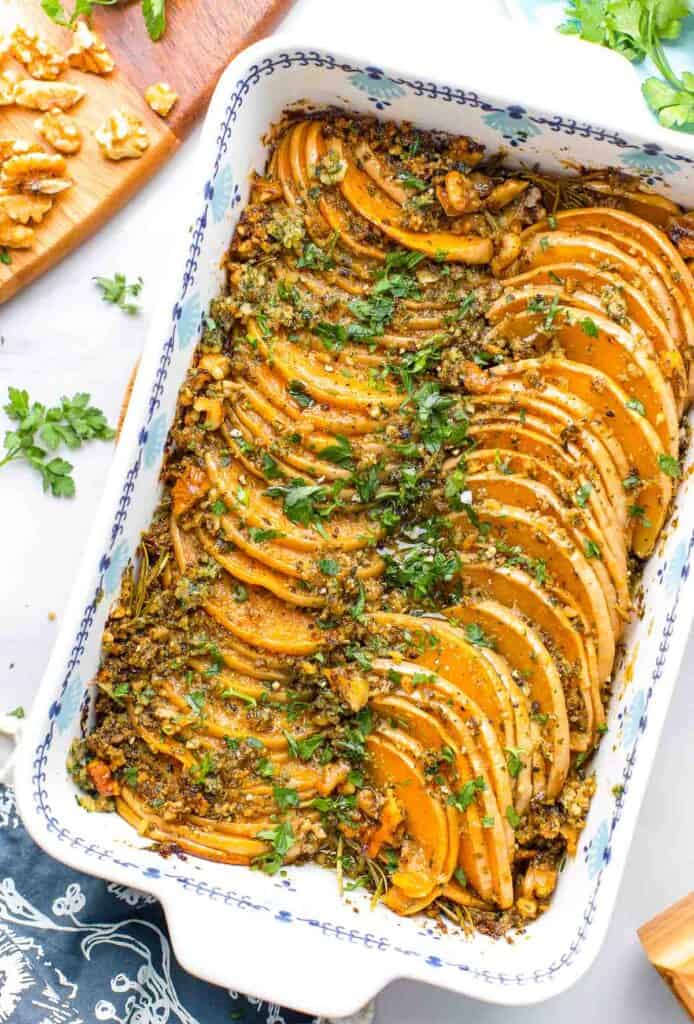 roasted-butternut-squash-rounds-with-pesto in a roasting pan