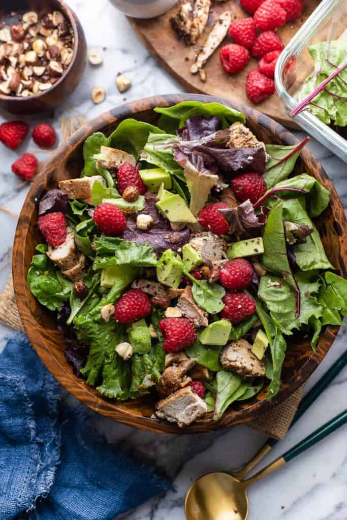chicken and raspberry salad with avocado and hazelnut without any dressing