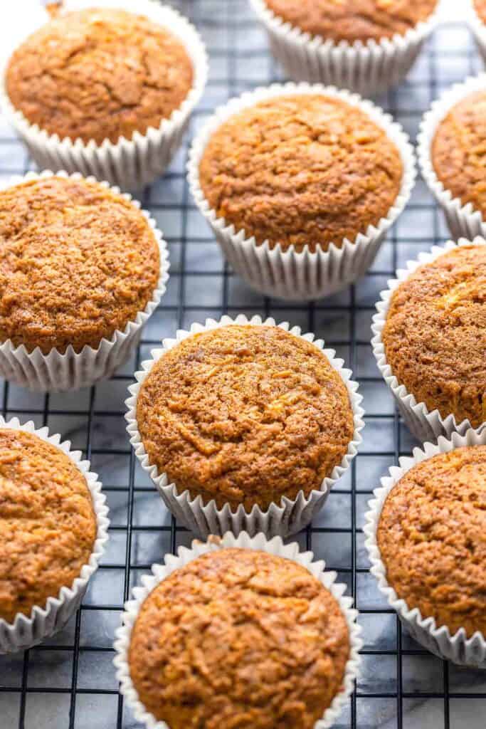 Carrot & Apple Flaxseed Muffins on a wire cooling rack