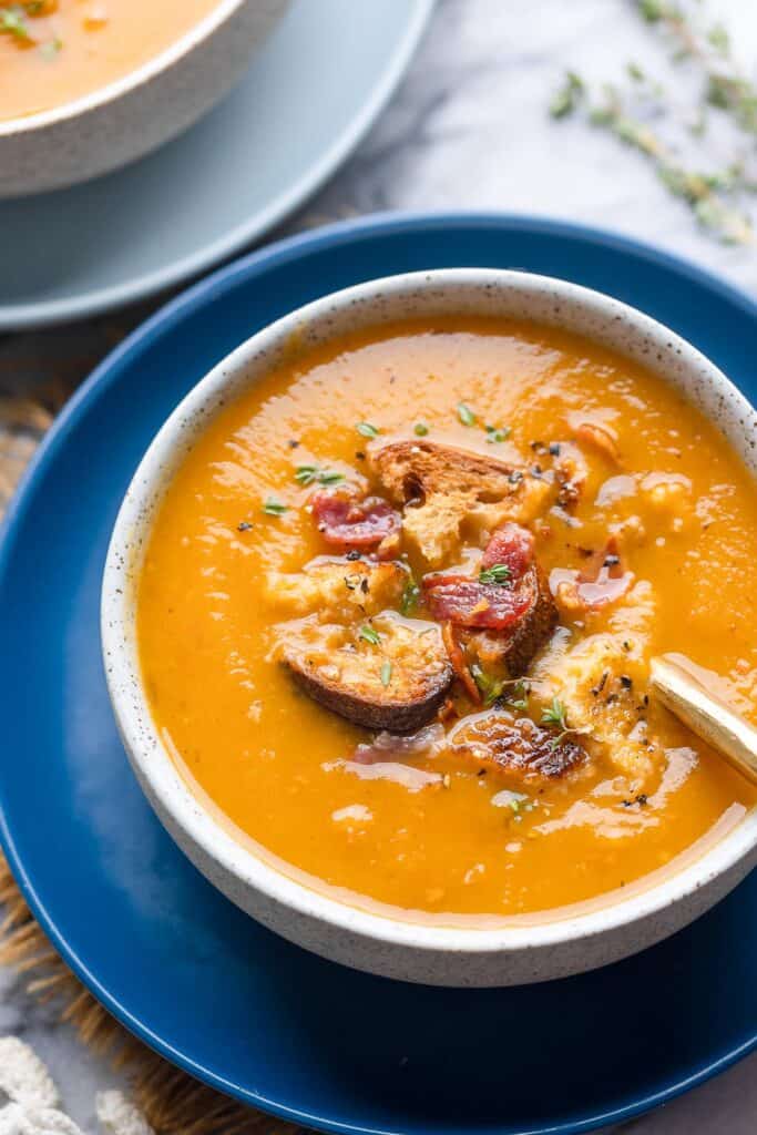 a soup bowl full of instant pot butternut squash soup