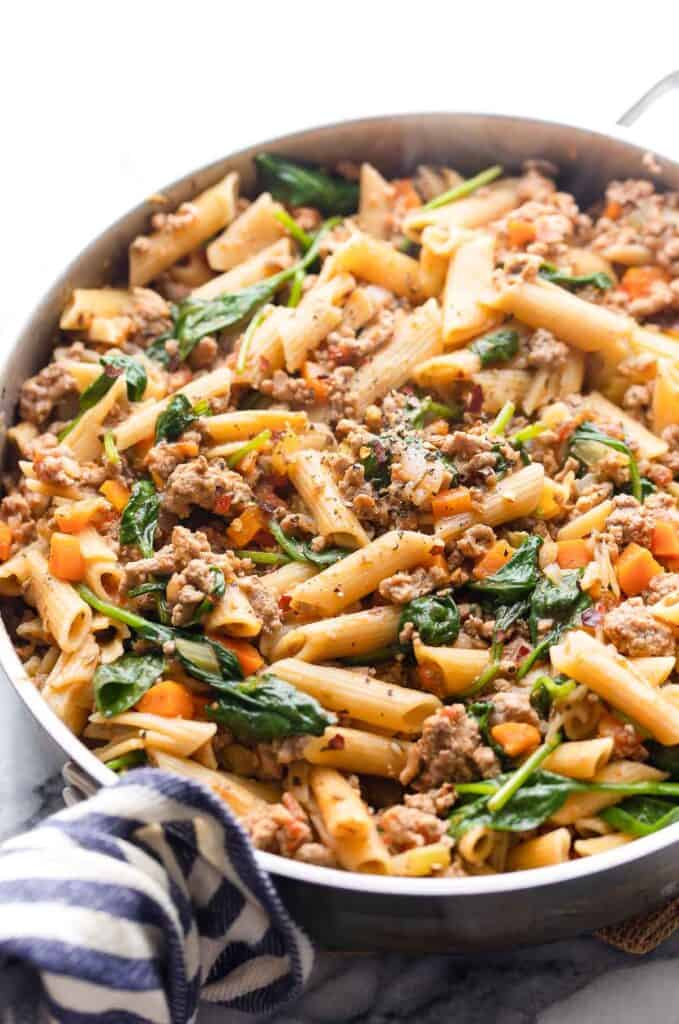 a skillet with Ground Turkey Pasta on a marble counter