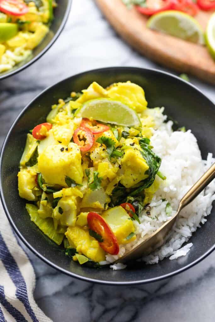 Spinach & Turmeric Fish Curry in a bowl with rice