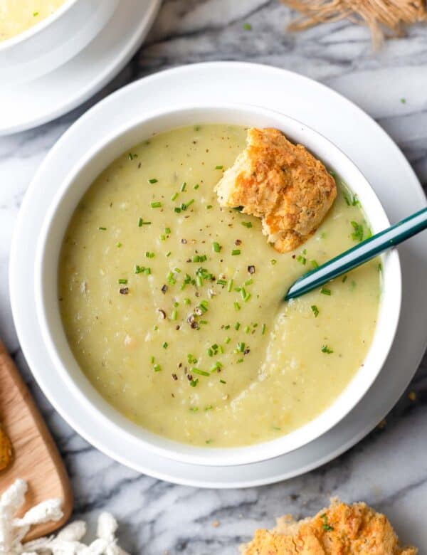 potato leek soup with a bread roll inside