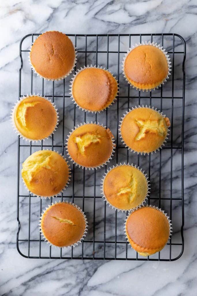 Gluten Free lemon muffins cooling on a wire rack