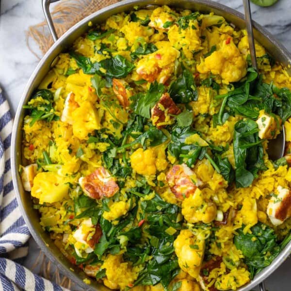 a stainless steel pan full of Curry Rice with Cauliflower and Halloumi