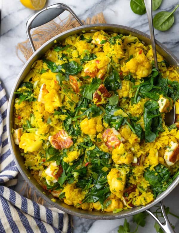 a stainless steel pan full of Curry Rice with Cauliflower and Halloumi