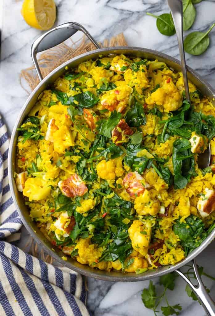 a stainless steel pan full of Curry Rice with Cauliflower and Halloumi