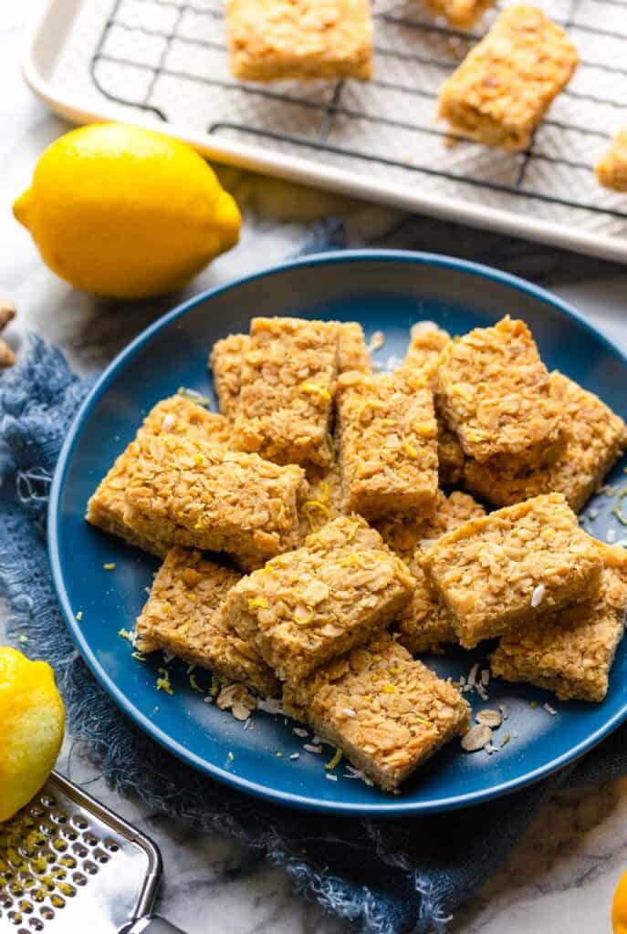 Lemon Ginger Flapjacks cut into 2 inch portions on a plate