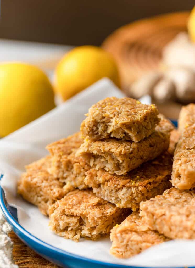 Lemon Ginger Flapjacks piled on plate with the top two cut in half