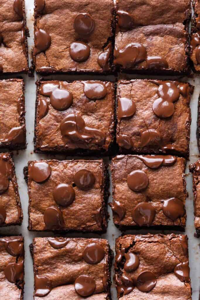 Almond Butter Flourless Brownies cut into squares on baking paper