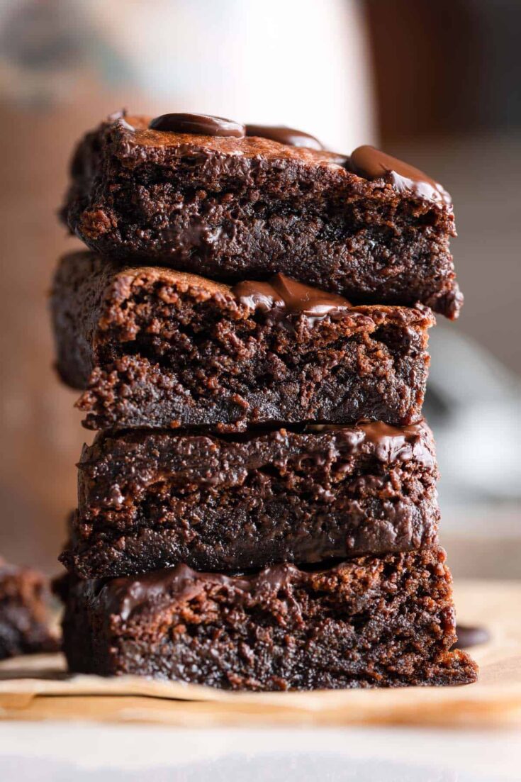 a stack of four Almond Butter Flourless Brownies