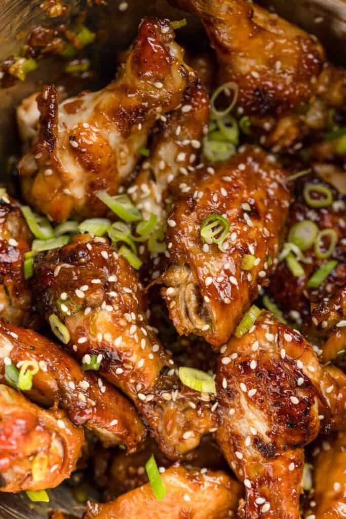 honey garlic chicken wings mixed with freshly sliced green onions and sesame seeds