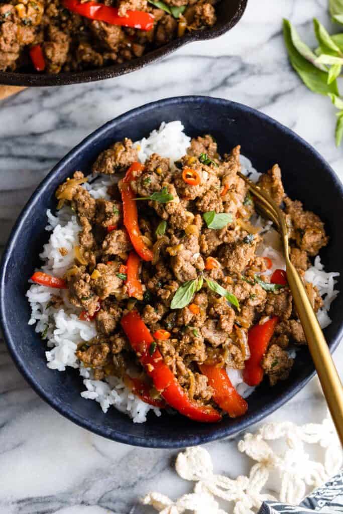 Thai Basil Beef stir fry in a bowl with a fork