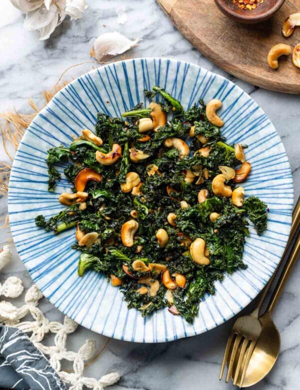 Garlic & Chili Sautéed Kale with Toasted Cashews in a bowl