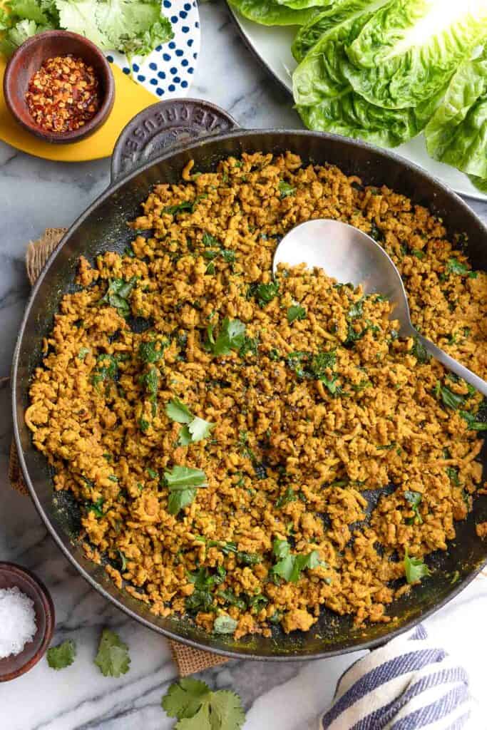 ground pork cooked in a cast iron skillet