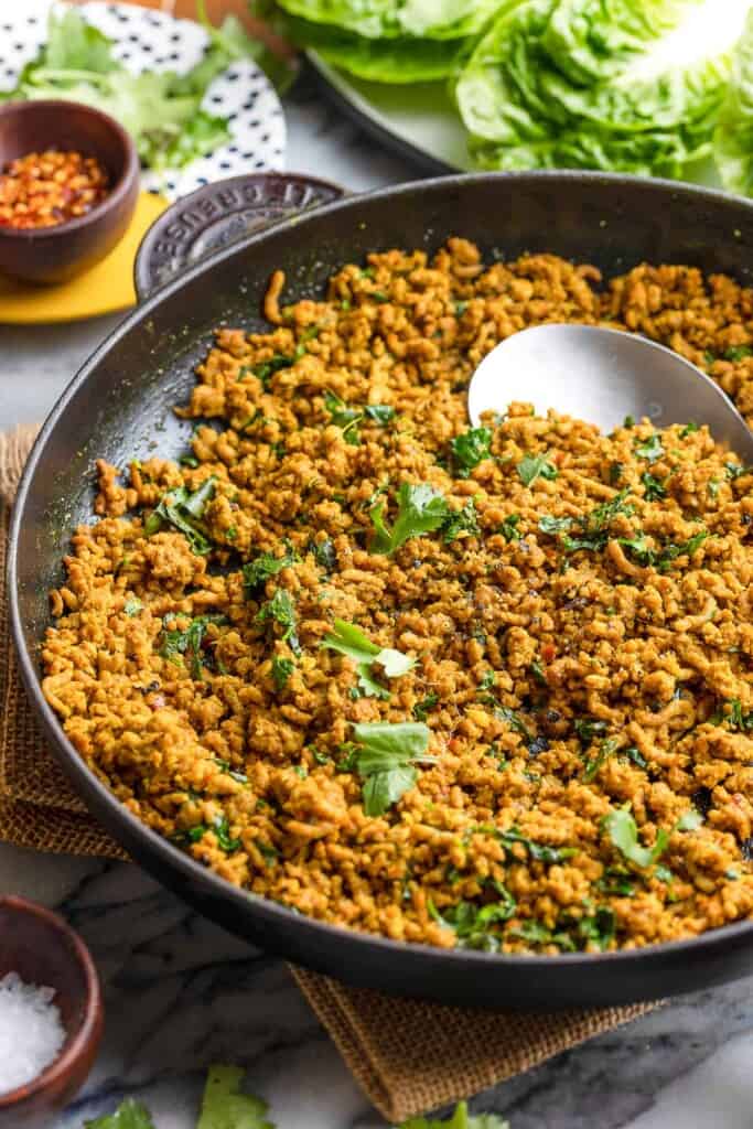 stir fried ground pork in a cast iron pan