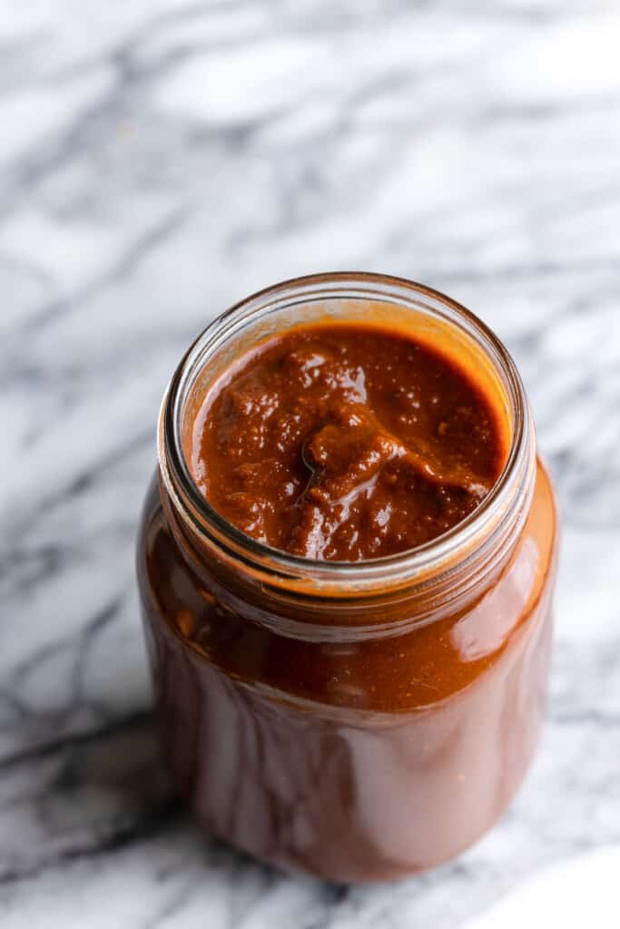 homemade enchilada sauce in a jar