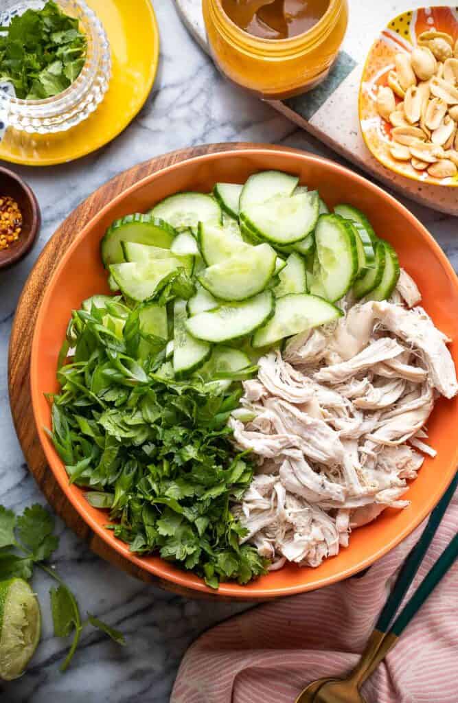 cucumber chicken salad ingredients in a serving dish before they get tossed together 