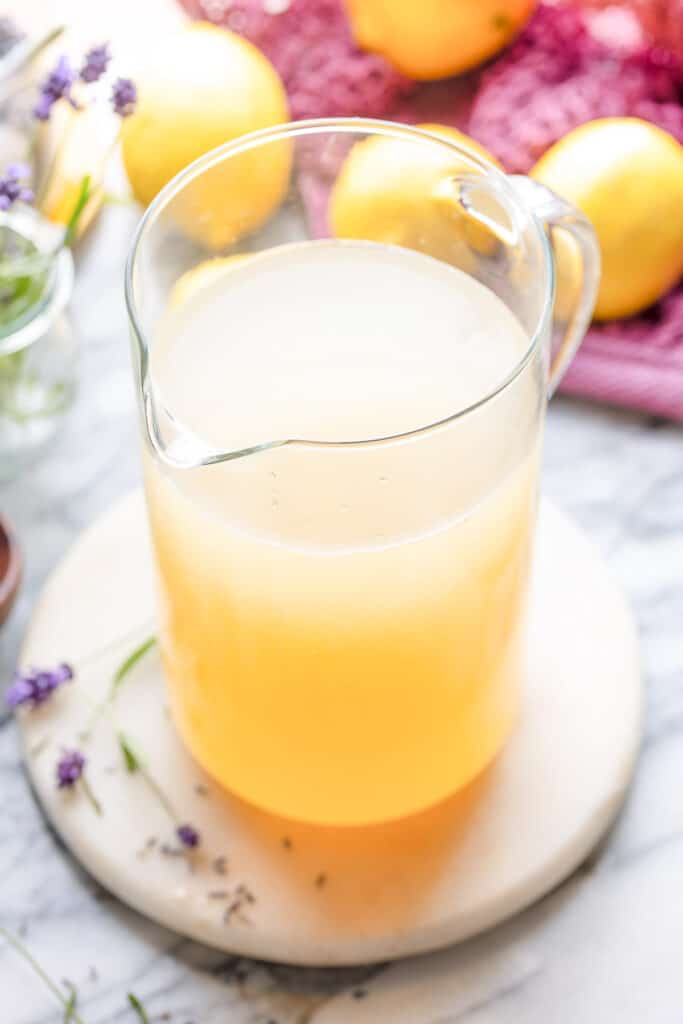 a tall pitcher of lavender lemonade 