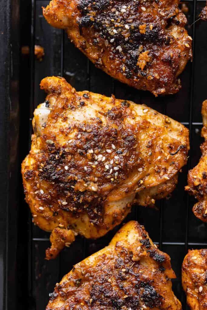 a Baked Paprika & Za'atar Chicken Thigh on a wire baking rack