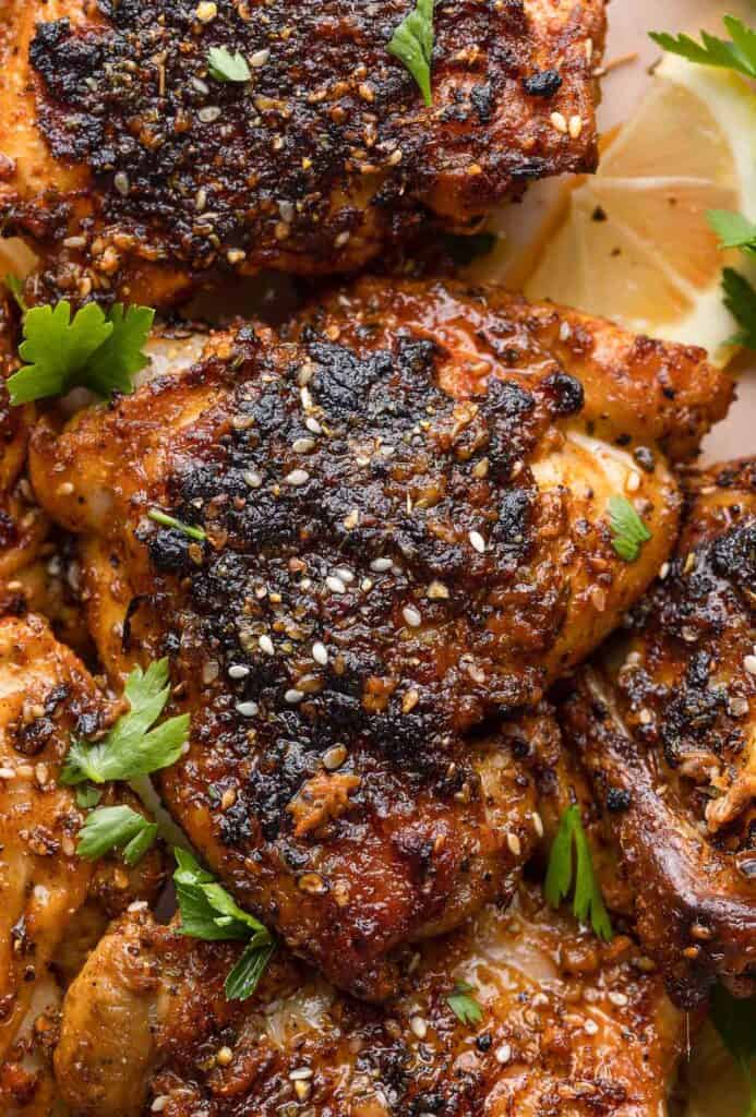 Baked Paprika & Za'atar Chicken Thighs with za'atar sprinkled over the top and fresh parsley 