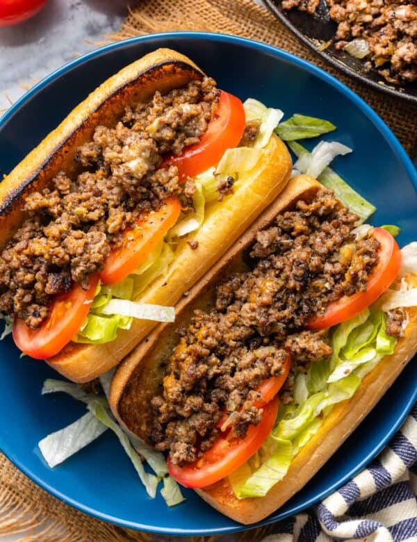 two Chopped Cheese Sandwiches on Gluten Free buns with lettuce and tomato