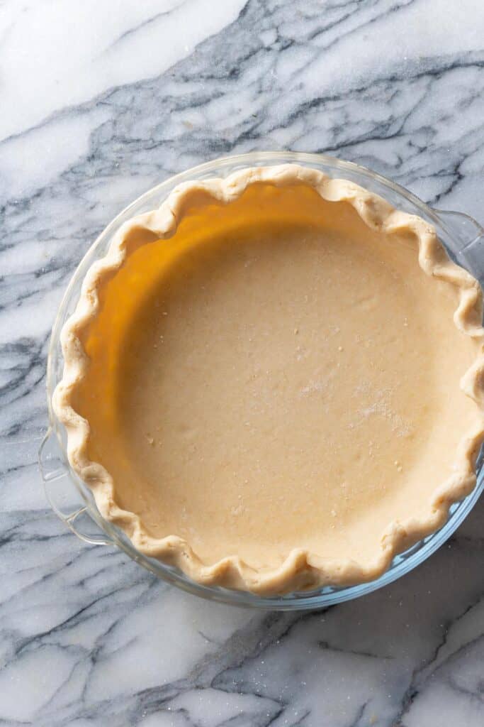 unbaked Cassava Flour Pie Crust in a pie dish